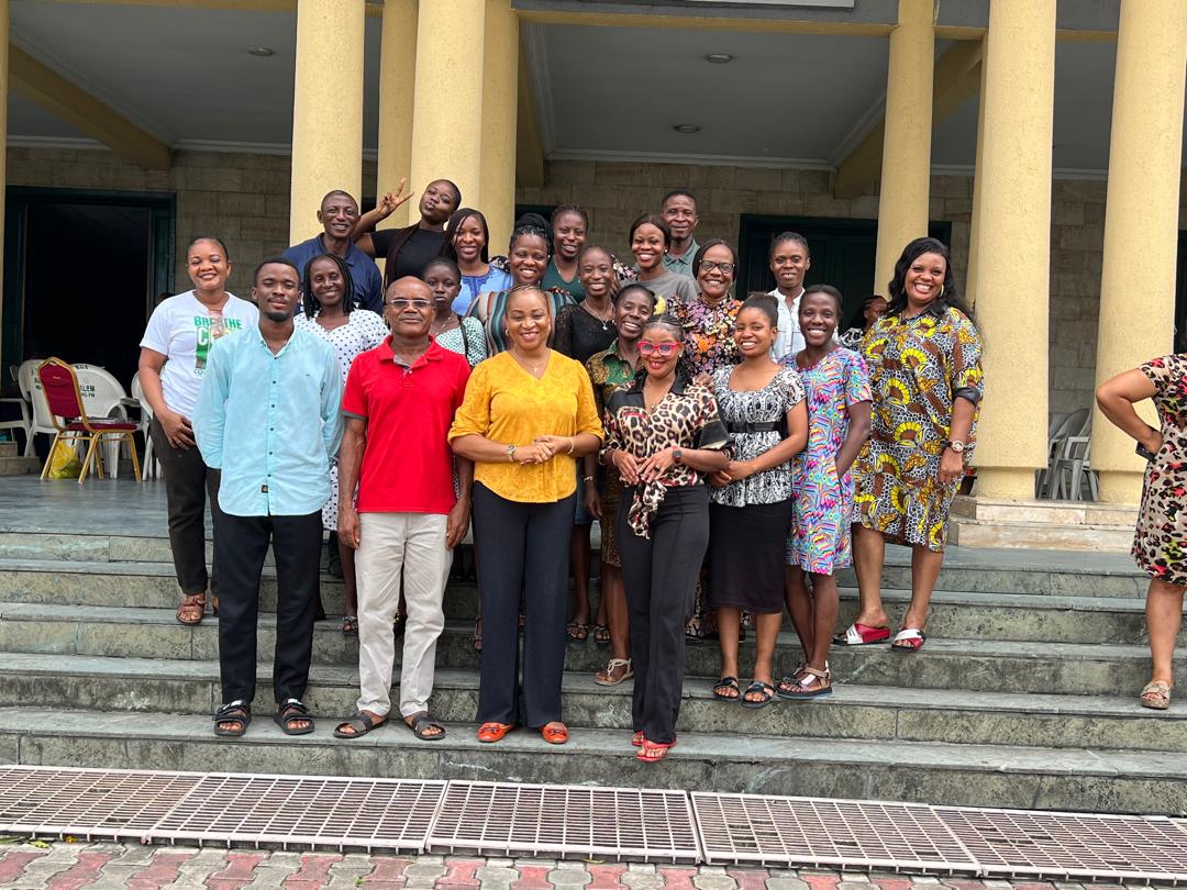 Uche with a group of event participants